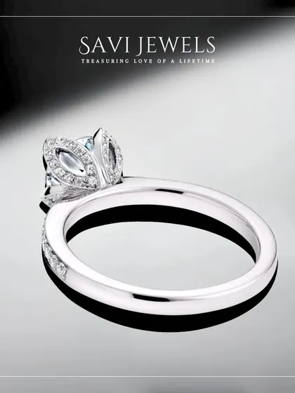 A side view of this floral-inspired solitaire ring, showcasing the intricate details of the setting. I design every angle to be beautiful, ensuring your ring is a work of art from all perspectives.