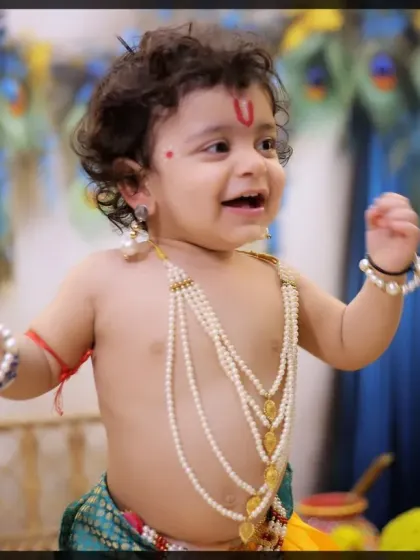 The pure, uninhibited joy of childhood captured in our Krishna-themed session. We aim for expressions that are both authentic and heartwarming.