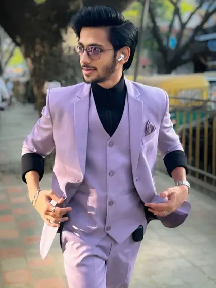 Walking with confidence. This lavender suit is a great way to add a pop of color to your formal wardrobe.