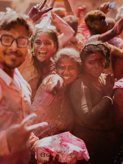 A vibrant collection of images from the Holi celebrations in Braj, specifically Nandgaon. This series captures the pure ecstasy of the festival, with portraits of devotees, men dressed as gopis, and crowds dancing in a cloud of colors.