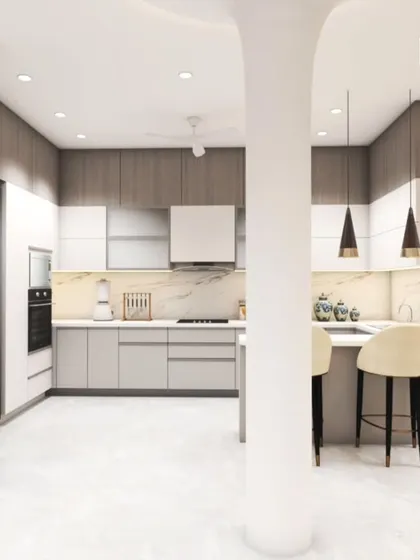 An open-concept kitchen featuring two-tone cabinets in wood and white, a marble backsplash, and a small breakfast counter with stylish pendant lights.