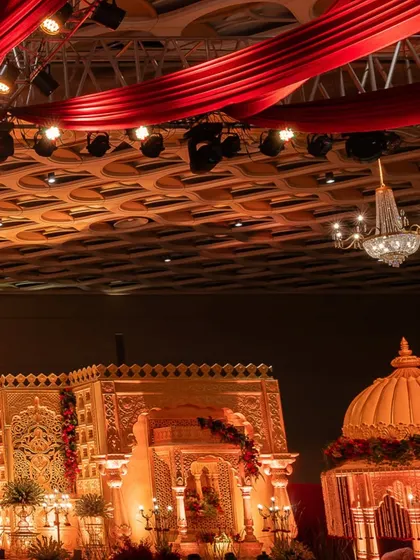 Another angle of the palace-themed stage, highlighting the domed structures and the balance of architectural and floral elements.