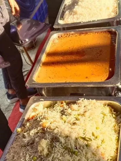 A view of the buffet line at a housewarming party, showing the variety of dishes we provide for your special day.