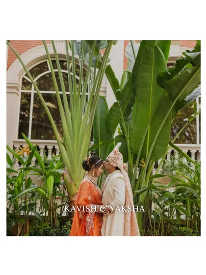 An intimate portrait of the couple surrounded by lush greenery. This shot emphasizes their connection while using the natural environment to create a beautiful, serene composition.