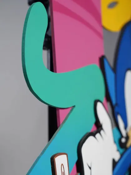 A detail shot showing the edge of a wood cutout on the Sonic piece. The precision of the cut allows for really clean and sharp color transitions.