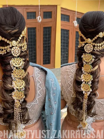 This is an example of a highly detailed and traditional bridal braid. I incorporated an elaborate gold 'jada' hair accessory that cascades down the length of the braid, creating a truly regal and unforgettable look for the wedding day.