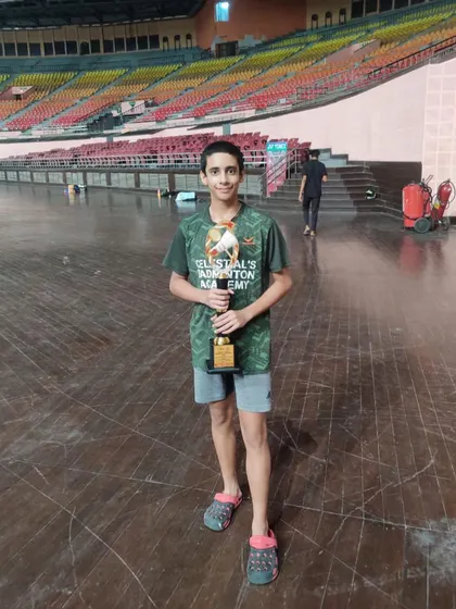 Our champion Siddhant Thakur holding his trophy after winning the Mixed Doubles U-15 title at the Delhi State Championship.