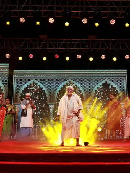 I use special effects like haze and focused spotlights to create dramatic moments on stage. This scene from a song launch event highlights the main performer, creating a powerful and theatrical entrance.