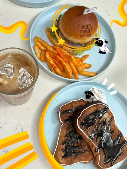 A cute meal with some even cuter doodles. I added little sheep characters to this photo of a burger and french toast.