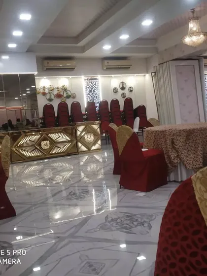 Another angle of the banquet hall, showing the spacious layout and how my golden buffet counters complement the elegant decor.