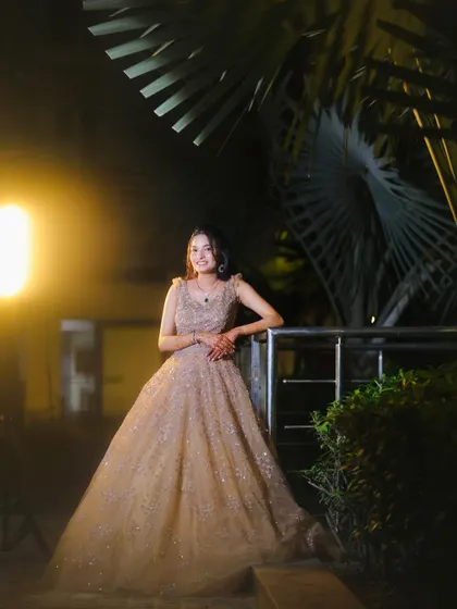 A full-length view of the client in her gorgeous beige engagement gown. The makeup was designed to be glamorous yet feel light and comfortable.