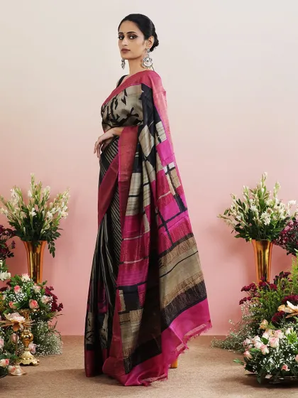 A side view that captures the interesting play of different patterns on this unique saree.