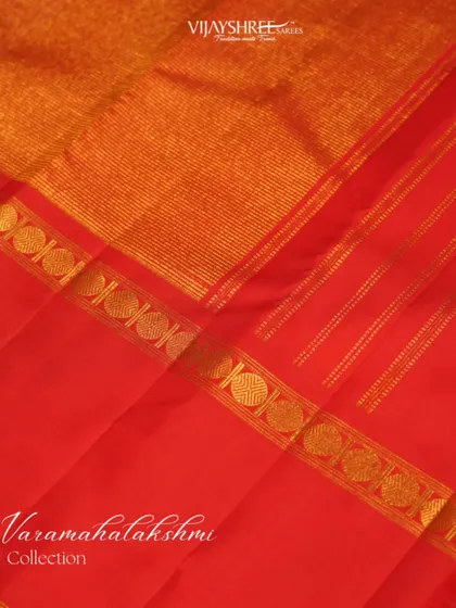 A detailed shot of the gold zari work within the Bentex border, showcasing its intricate craftsmanship.