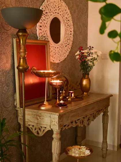 Another festive look for my foyer, with a floor lamp, candles, and fresh flowers. It’s all about creating layers of light and texture.