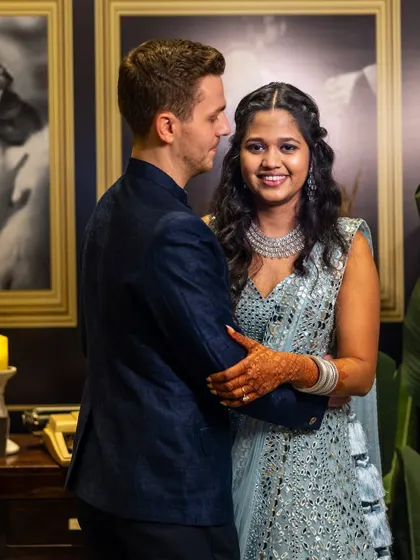 An intimate moment between the bride and groom. Her reception look features a sparkling lehenga with soft, open hair and a diamond necklace, a modern and elegant choice for the evening's festivities.