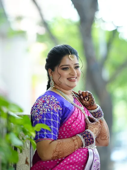 A happy, candid moment. The soft glam makeup enhances her features and her joyful expression.