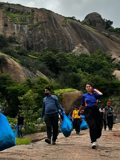 Team members carrying down bags of collected waste from the Uttari Betta trail. It is a rewarding experience to leave a place better than you found it.