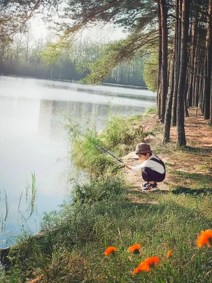 A quiet moment of fishing by the lake. This creative outdoor portrait shows how we can build a story and capture a child's imagination.