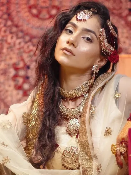 Moments from our Heeramandi-inspired shoot. These images showcase the intricate details of the makeup, hair, and styling, capturing the mood and opulence of the era.
