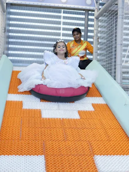 Dressed like a princess but ready for adventure. Our play areas are designed for all kids, whether they're in party dresses or play clothes, to have a fantastic time.