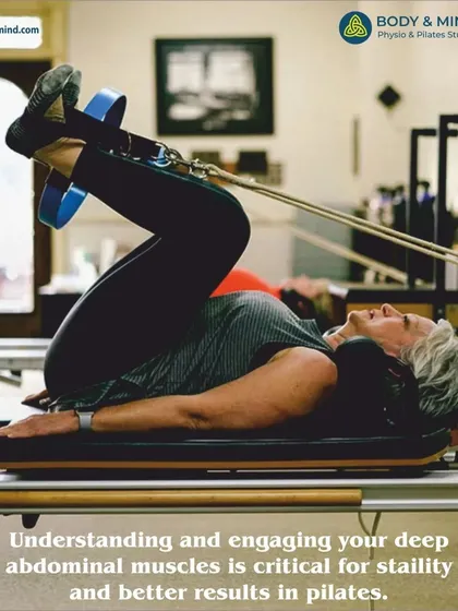 A closer look at a client engaging her core on the Reformer. This controlled movement is fundamental for achieving better results in Pilates.