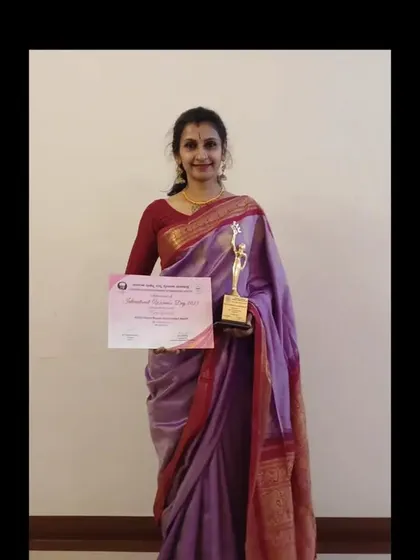 Holding the award and certificate. This recognition inspires us to continue our work with even greater dedication.