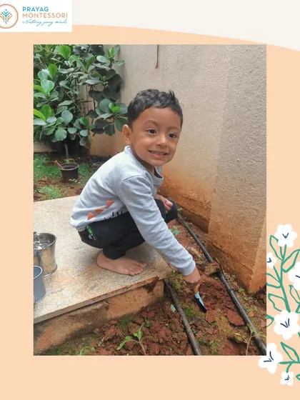 A proud young gardener at work. These practical life activities build responsibility and a respect for the environment.