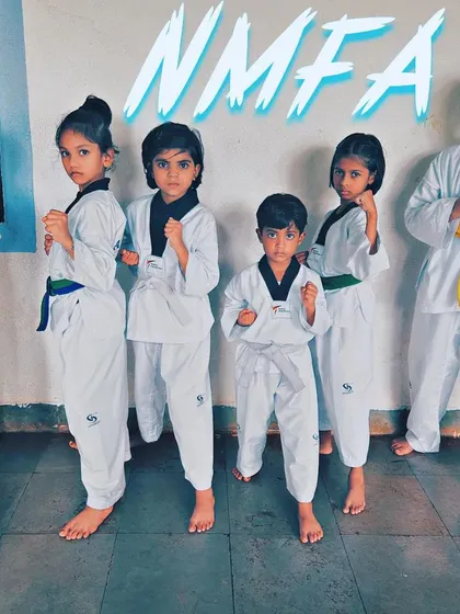 The next generation of NMFA Taekwondo champions, ready and focused. This image captures the fighting spirit we nurture from a young age.