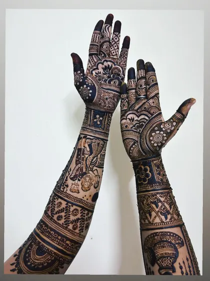 An example of my full-coverage bridal mehndi. This design extends up the arm with dense, traditional patterns, resulting in a breathtakingly dark and uniform stain.
