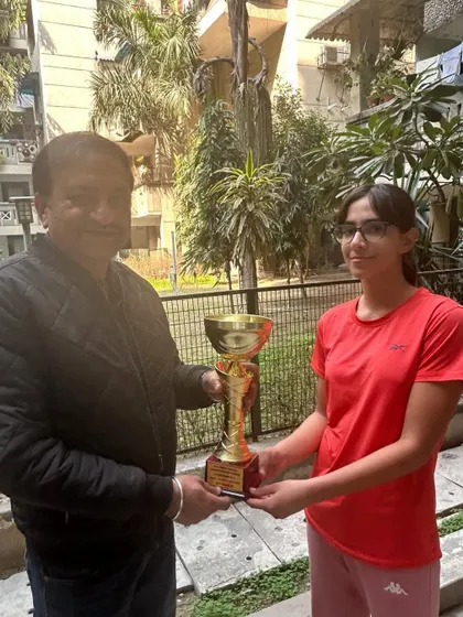 Another first title for Eshanya Khattar, this time winning the All India AITA CS U-14 singles tournament in Delhi. She is seen here receiving the large winner's cup.