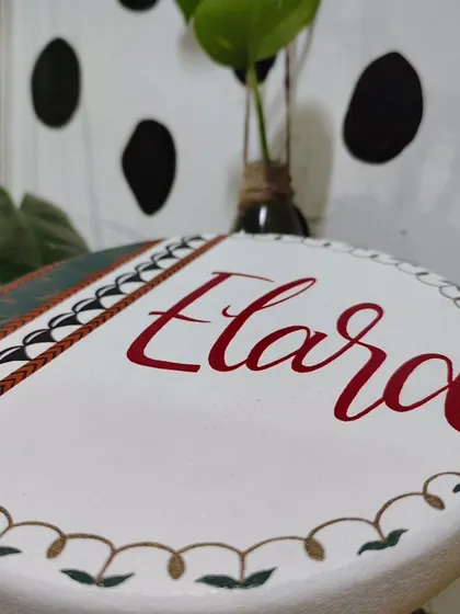 This traditional Indian art-inspired name board for "Elara" was a joy to create. We wove the family's roots into an earthy palette with a contemporary twist, creating a piece that traveled all the way to Germany.