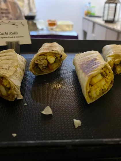Kathi Rolls are a hearty and flavorful option for any event. These wraps are filled with spiced paneer and vegetables, offering a satisfying bite for your guests.