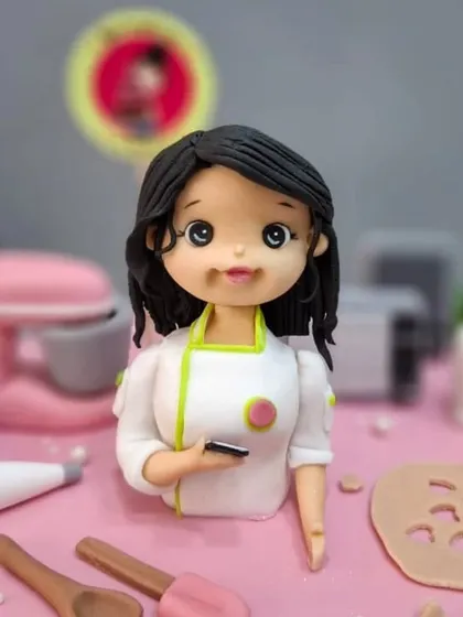A close-up of my own figurine from the surprise 10th-anniversary cake my team made for me. It’s me in my element!
