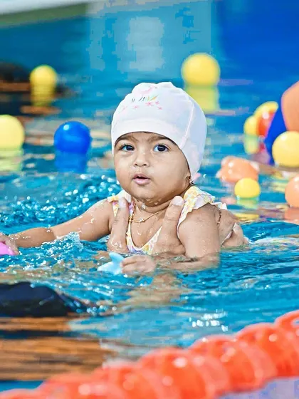 Our "Get Wet" program for toddlers is all about fun. We use colorful balls and games to create a positive, play focused water experience.