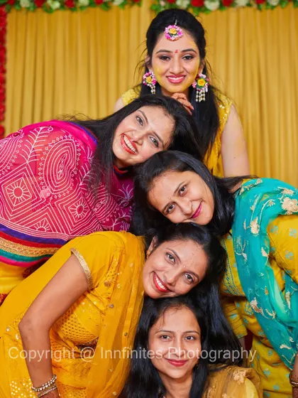 The Haldi ceremony is a celebration with loved ones. This fun group photo with the bride and her 'team bride' captures the spirit of friendship and joy.