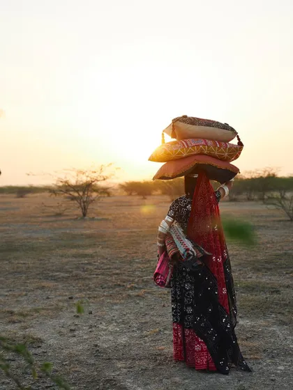 Part of the 'Vikreta' series, this image tells a story of resilience and craft. It’s a lifestyle product campaign visual that connects the home decor pillows to a deeper, human narrative.
