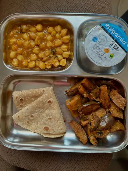 A simple yet fulfilling meal of chapati, channa masala, and sautéed sweet potato, providing a great balance of complex carbs and plant-based protein.