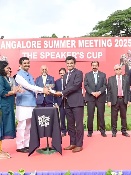 Shri. Rudrappa Manappa Lamani, Hon'ble Deputy Speaker, presents The Speaker's Cup to the owners of Pluto.