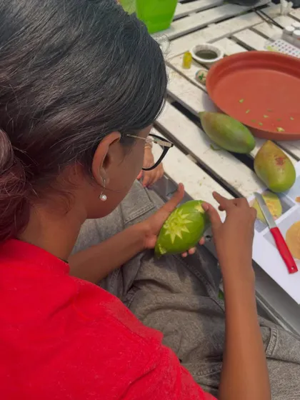 A guest gets creative with mango carving during one of our festival workshops. I love incorporating hands-on activities that are fun for all ages.