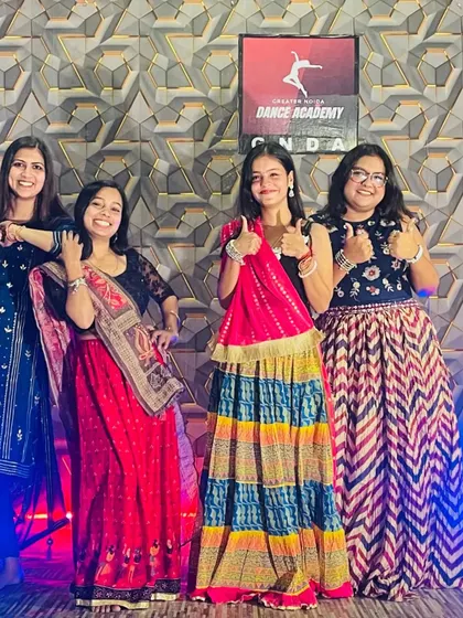 Thumbs up for the festive spirit! Our ladies are all set for a Garba and Dandiya session.