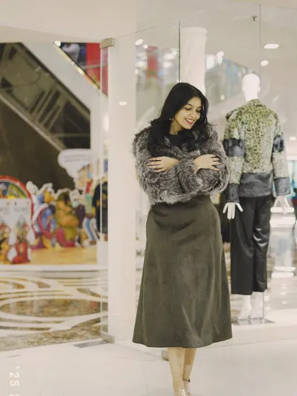 A cozy look with a grey faux fur jacket and a simple midi skirt. I love mixing textures to create an interesting winter outfit.