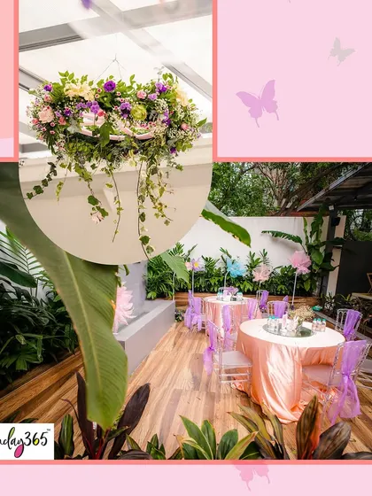 The elegant outdoor seating area for a butterfly-themed party, with beautiful floral arrangements and lush greenery.