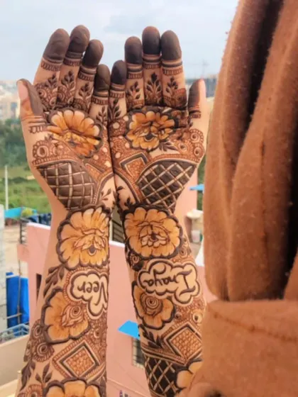 A beautiful bridal design with the couple's names, Veer and Inaya, lovingly written among the floral patterns.