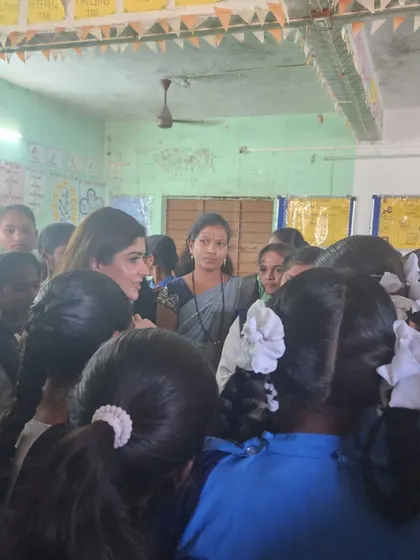 One of my most cherished memories is working with nearly 1,000 young girls with the Cosmo Foundation. Here I am, surrounded by them, after a session on soft skills and employability.
