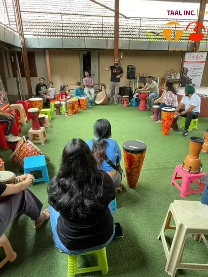 A shot from our community drum circle at Pune Handmade Papers. The rustic, creative atmosphere of the venue is the perfect backdrop for our sessions.