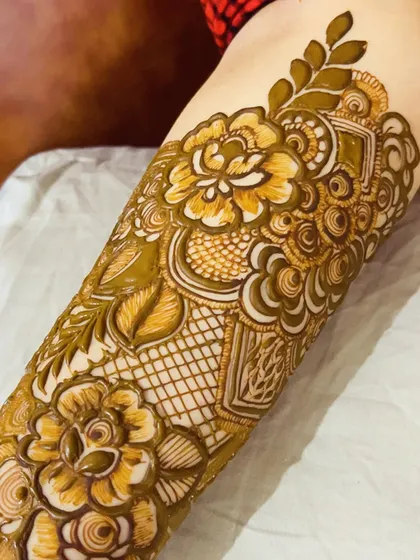 A close-up of a fresh floral henna application, showing the precision and detail that goes into creating these beautiful designs.