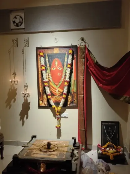 A volunteer carefully lights the 11 brass lamps on the wall next to the Devi Yantra. This is a key part of our Abhishekam ritual, symbolizing the 11 aspects of Devi's energy.