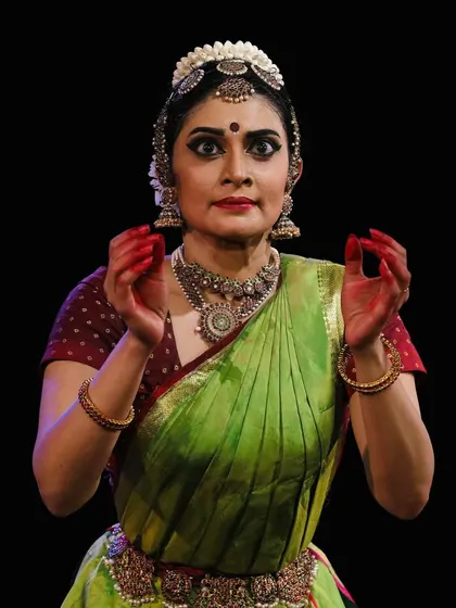 A direct and engaging gaze, inviting the audience into the narrative of the dance.