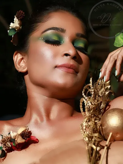 A close-up of the creative green eyeshadow look. You can see the detailed blending and the shimmering finish, which brings the whole artistic concept to life.