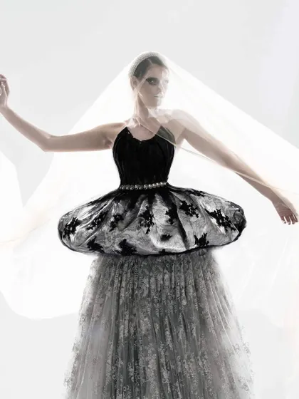 A full-length view of the swan-inspired draped creation. Using layers of sheer and embroidered fabric, I crafted a look that embodies the grace and mystery of a swan.